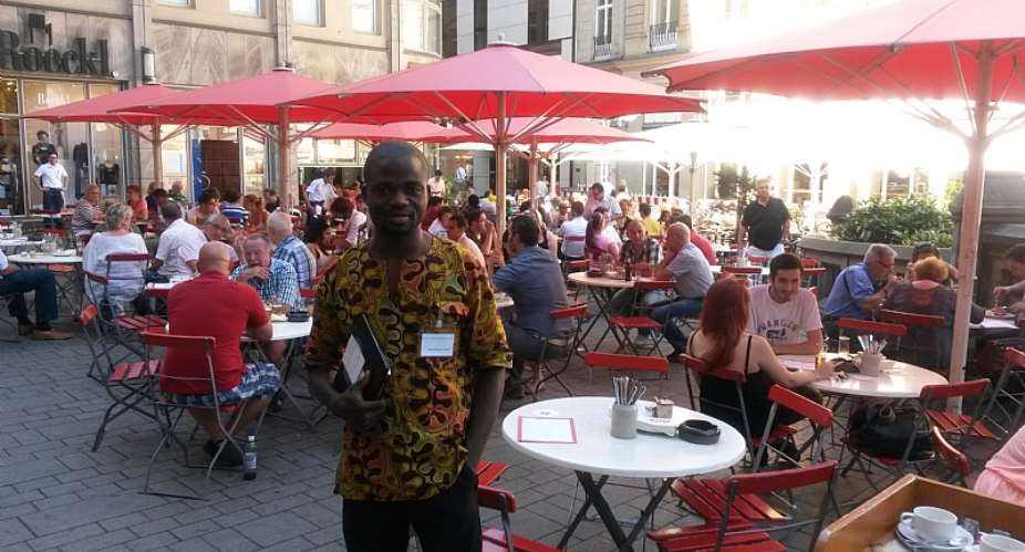 The writer, Manasseh Azure Awuni poses with his iPad at the bar he left it the previous day