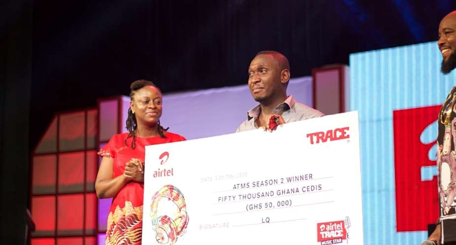 Moses Ugheighele still receives his prize from Rosy Fynn, Marketing Director, Airtel Ghana