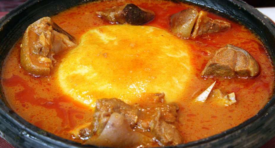 Fufu with light soup and meat