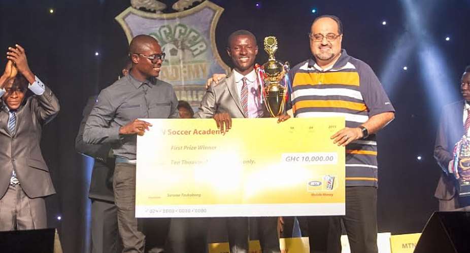 Charles Addai Danquah being presented with his cash prize