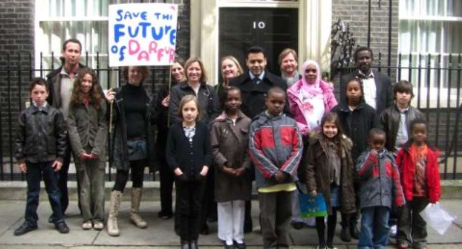 Shahid outside No.10 DowningStreet with British and Darfurian  school children raising awareness ofthe current situation in Darfur.