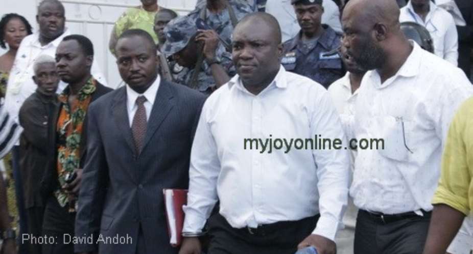 Ken Kuranchie and Stephen Atubiga being led into the prison van