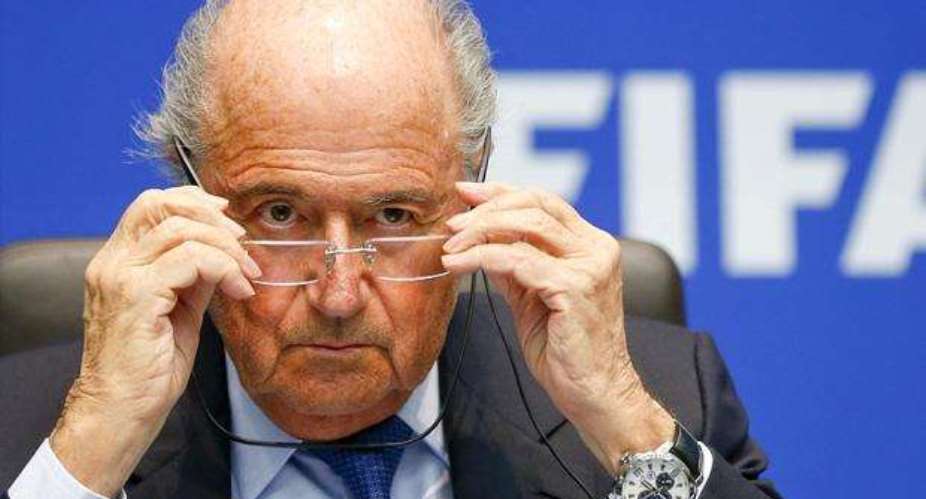 Fifa corruption inquiry: Sepp Blatter defies calls to quit