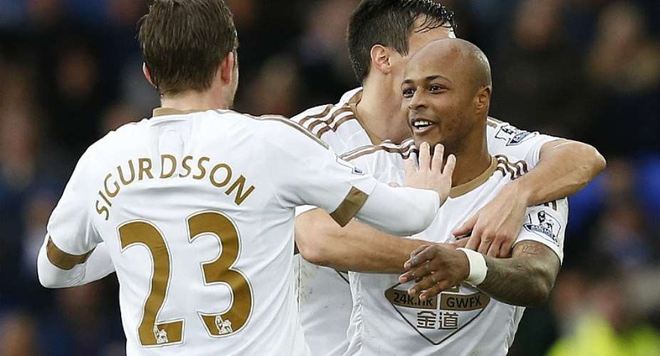 Ayew celebrates with his team-mates after scoring the goal on Sunday