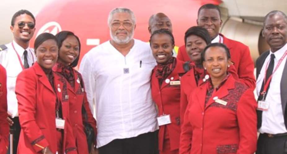 Crew of Kenya Airways are all bubbly in this pose with President Rawlings after one of their flights to Accra