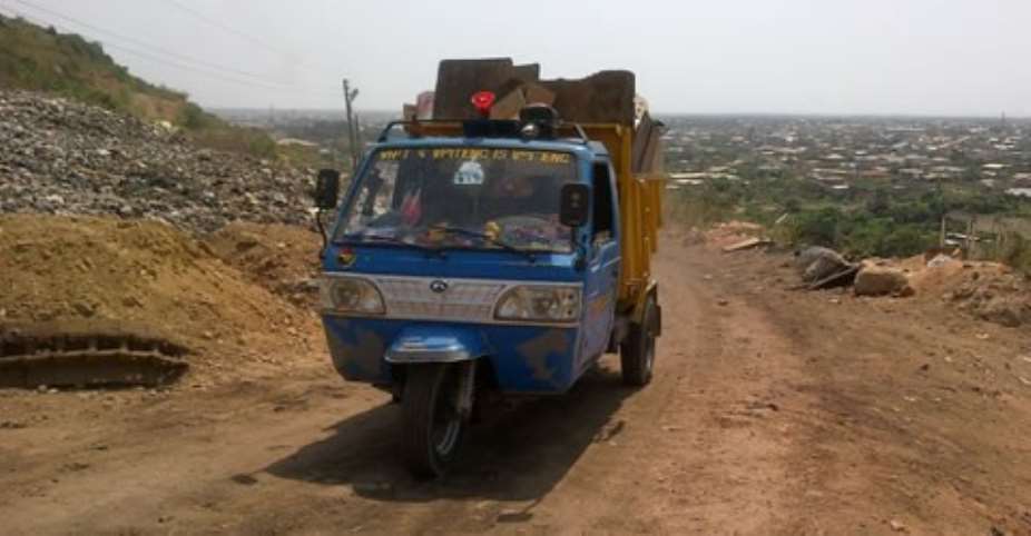 A vehicle heading to the dump site to offload refuse