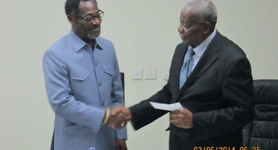 Drolor Bosso Adamtey I, Chancellor of UPSA, handed the cheque to Justice Nii Aryeetey, UPSA Governing Council Chairman