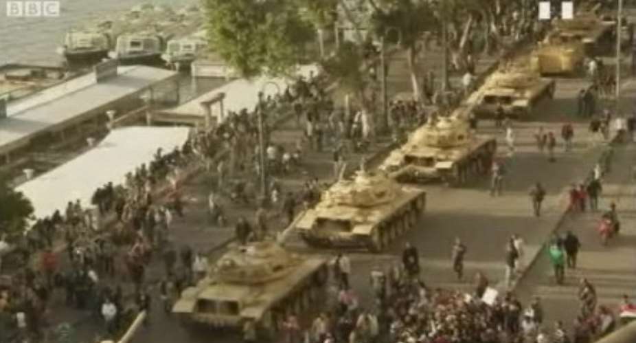 Military tanks and demonstrators take over the streets