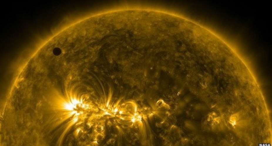 Venus top left seen by Nasa's Solar Dynamics Observatory moving on to the face of the Sun