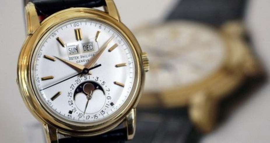 A Patek Philippe wrist watch, an 18K gold perpetual calendar watch with sweep centre seconds, phases of the moon and magnified calendar aperture, was manufactured in 1955.