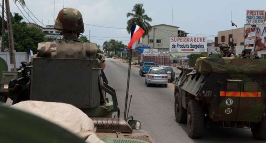 French soldiers are shown patrolling as part of the French Force Licorne in Port Bouet district of Abidjan, Ivory Coast on Saturday.