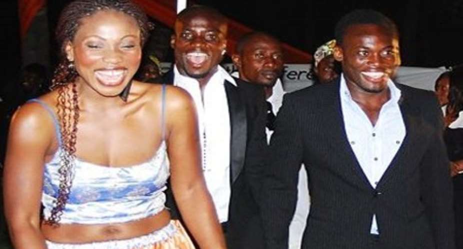 Akosua Puni and Michael Essien. Behind them is Stephen Appiah.