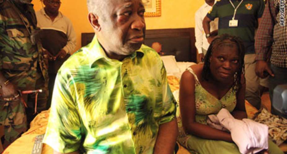 Laurent Gbagbo being dragged out by rebel forces on Monday