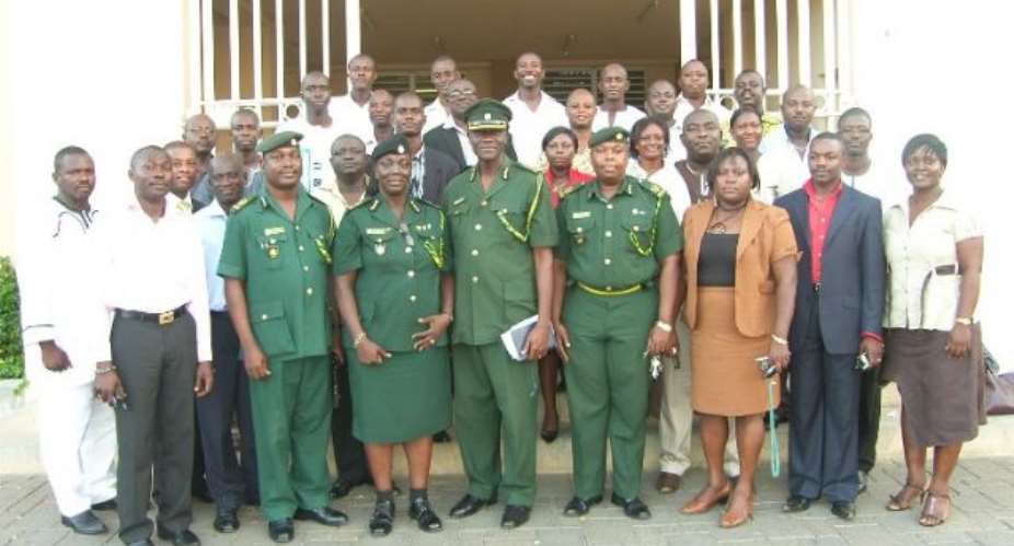 Deputy Director in charge of operation unity Moses K.Gyamfi (middle) with some Assist. Directors and the participants after the workshop.