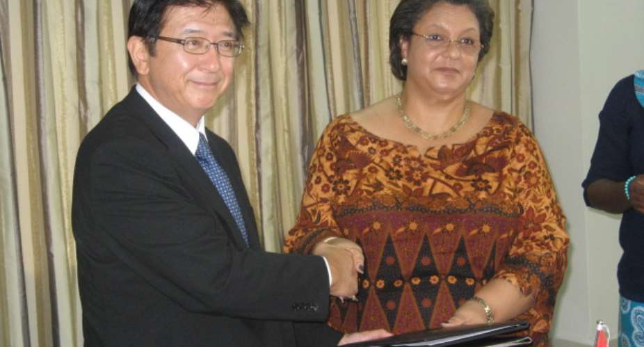 H.E. Kaoru Yoshimura, Japanese Ambassador and Hon. Hanna Tetteh, Minister for Foreign Affairs exchanging the signed Grant