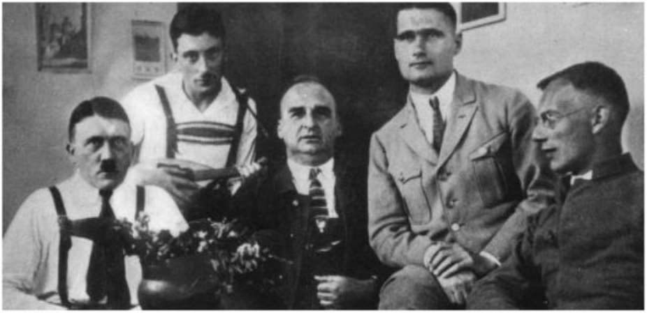 Hitlers deputy Rudolf Hess 2nd from right, (with other followers) visits Hitler (left) in jail.