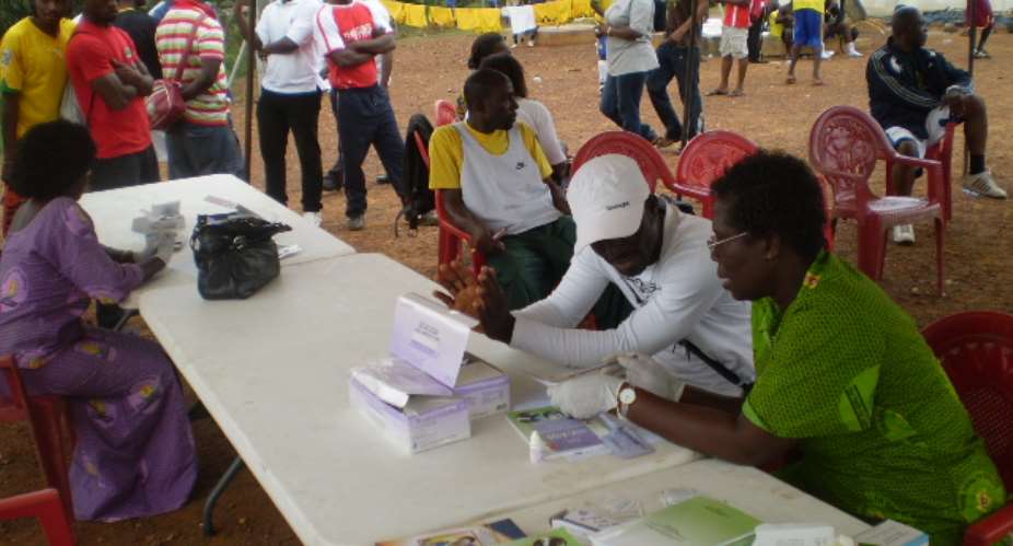 Workers voluntarily test for HIV status