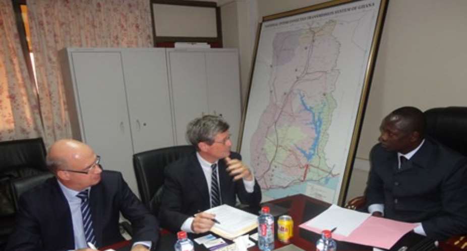 Mr. Yves Boudot, AFD Director for Africa (2nd from left) making a point to Minister for Energy and Petroleum, Emmanuel Armah-Kofi Buah (right) at the meeting. At the extreme left is Bruno Leclerc, Resident Manager of AF.jpg
