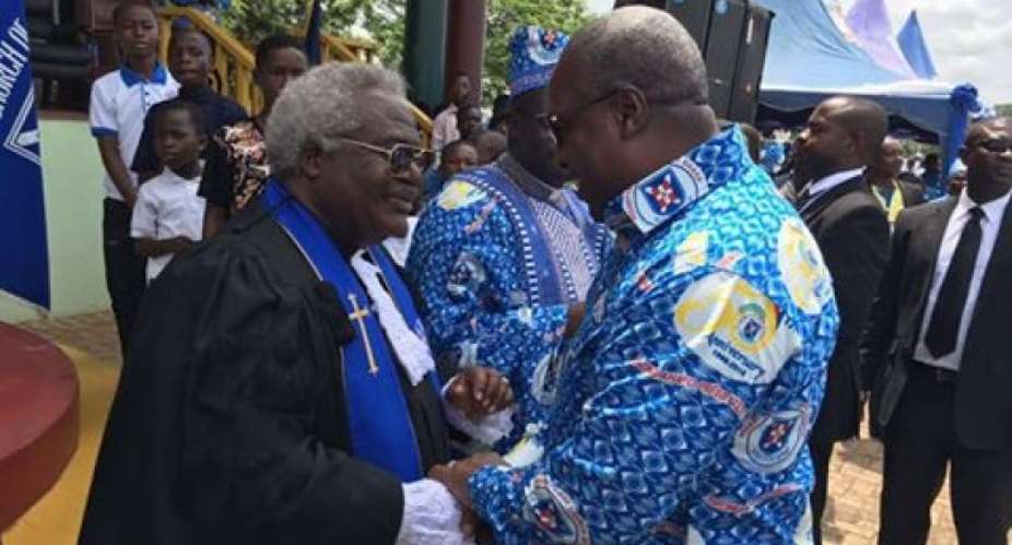 President John Mahama right in a handshake with Professor Emmanuel Martey