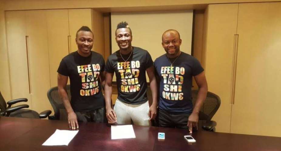 Ghana skipper Asamoah Gyan hours before signing record breaking move with brother Baffour Gyan and Samuel Anim Addo