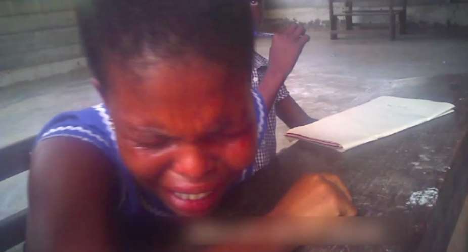 A girl crying out of pain
