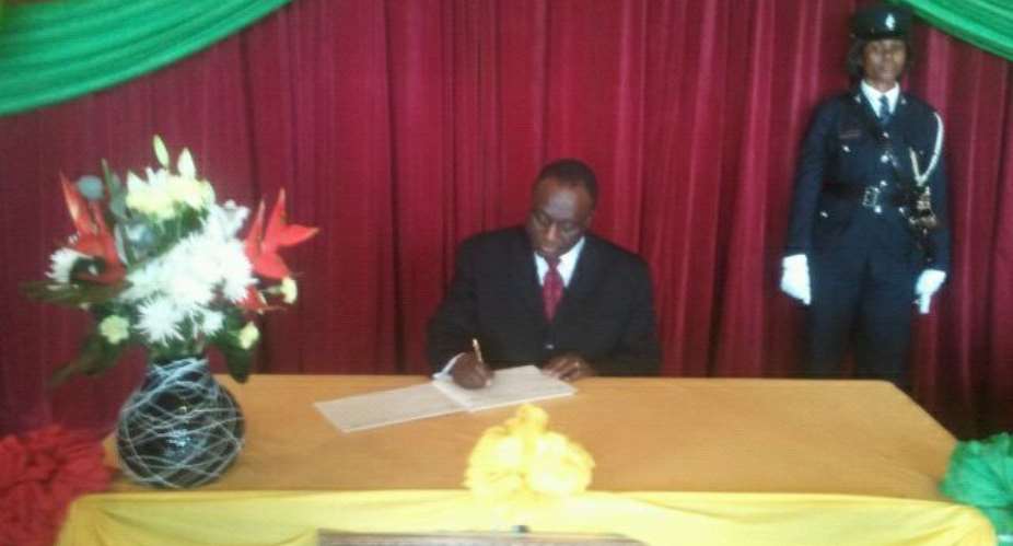 Pictures from State House Alan signs Book of Condolence