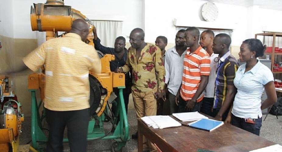 Hon Edward Ennin with ObuasiApprenticeship students at AGA Engineering Training Centre