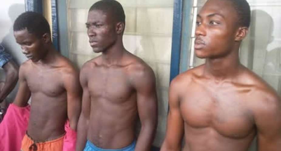 The suspects paraded at the police station.