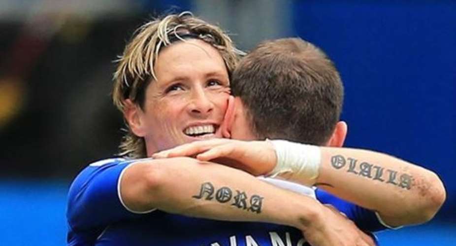 Fernando Torres in a hearty hug with Ivanovic