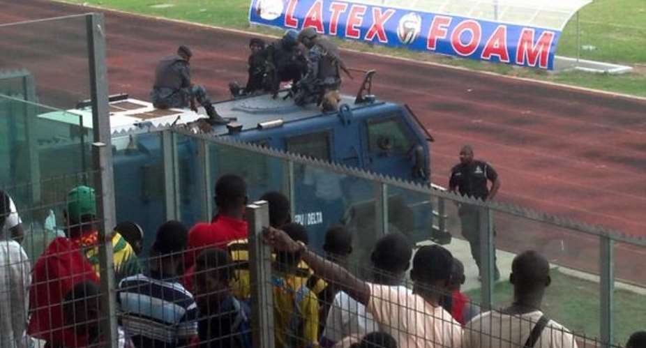 Kotoko players being conveyed in an armoured car at the Baba Yara Stadium.