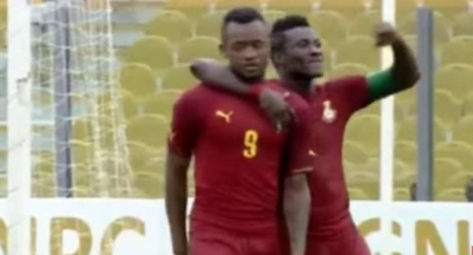 Asamoah Gyan celebrates with Jordan Ayew after the latter provided an assist