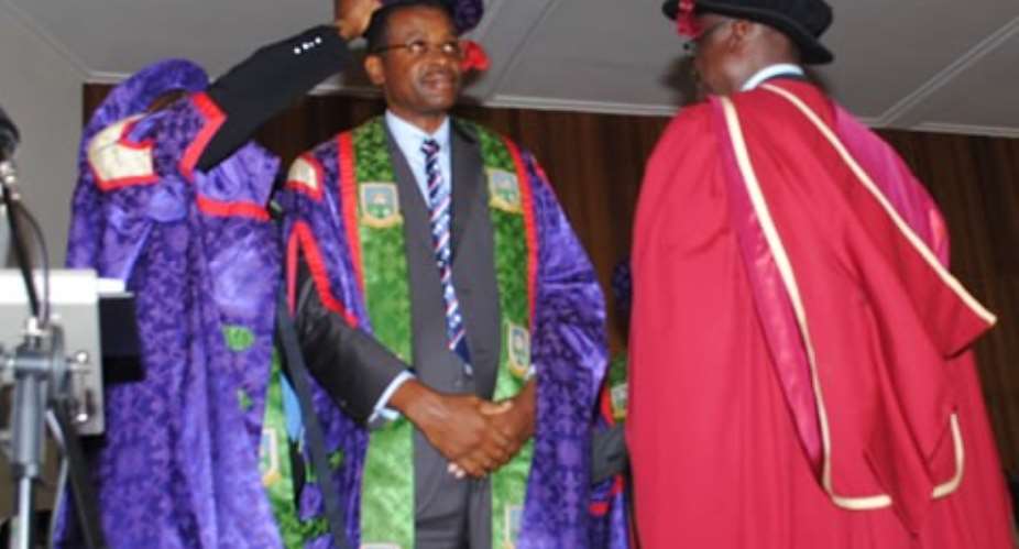 Prof Kuma,(middle) being robed as VC by UMaT Council Chairman(L)