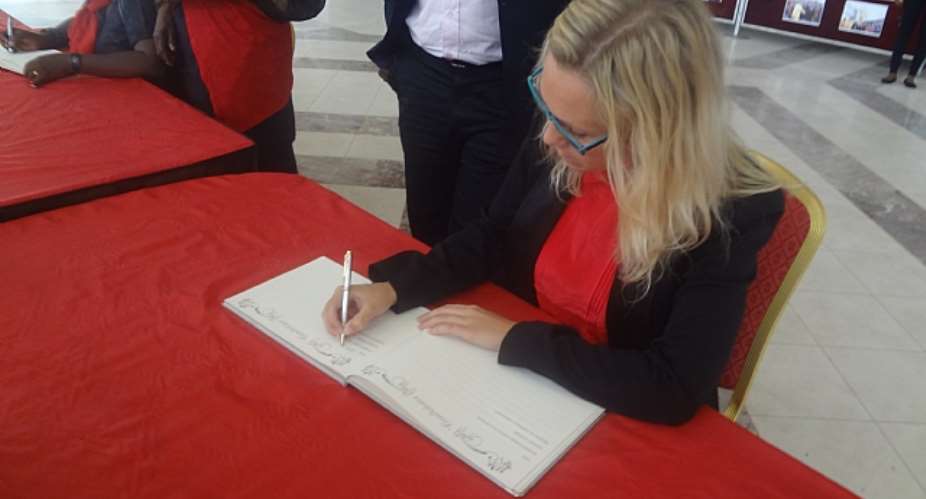 CEO OF VIASAT1 SIGNS PRESIDENT MILLS BOOK OF CONDOLENCE