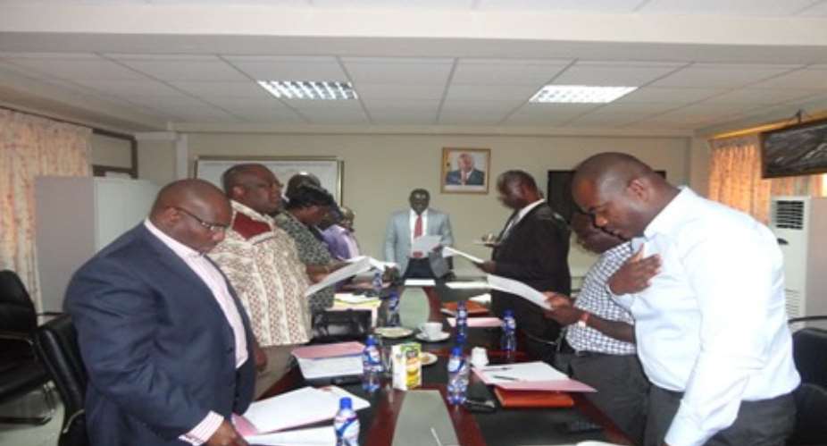 Mr. Buah (Head of Table) swearing in the committee of inquiry.