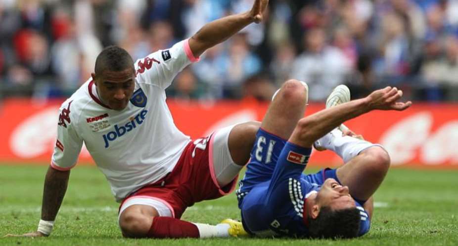 Michael Ballack r. Is down injured after he was fouled by Kevin-Prince Boateng in May 2010