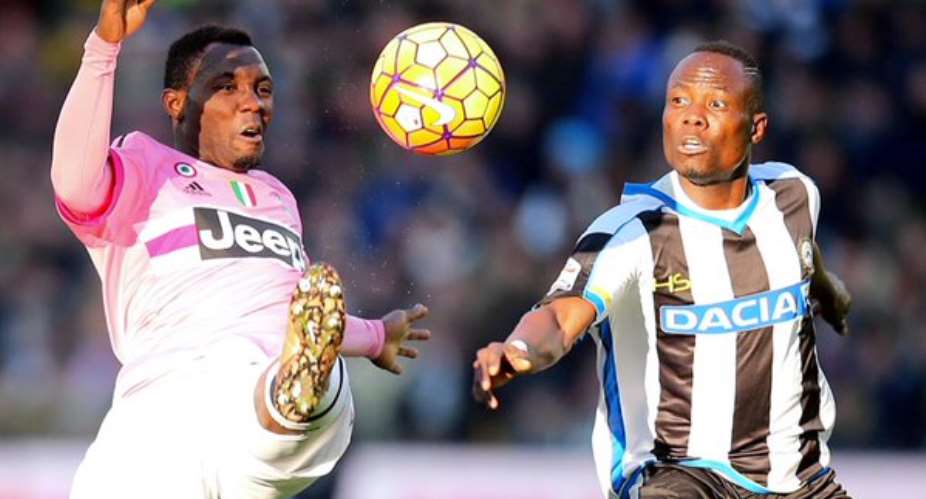 Juventus' Kwadwo Asamoah beats Agyemang Badu of Udinese to the ball in Sunday's game