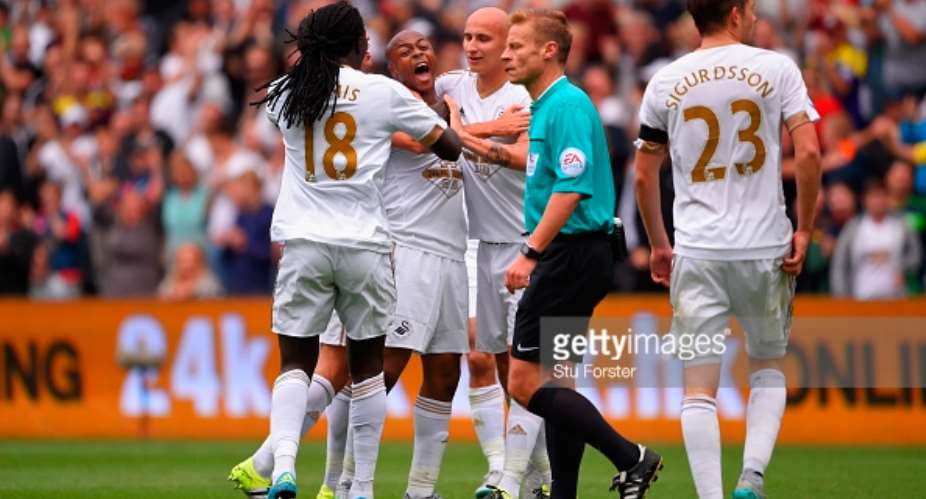 Ghana and Swansea City man Ayew mobbed Gomis and Shelvy