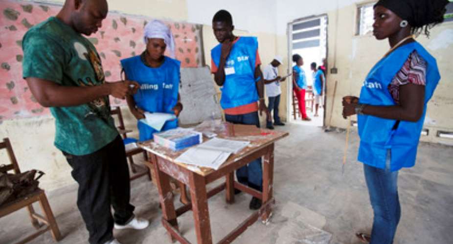 UN PhotoStaton Winter Liberian polling staff prepare ballots before inviting citizens into a polling station to vote in their countrys constitutional referendum, in Monrovia.