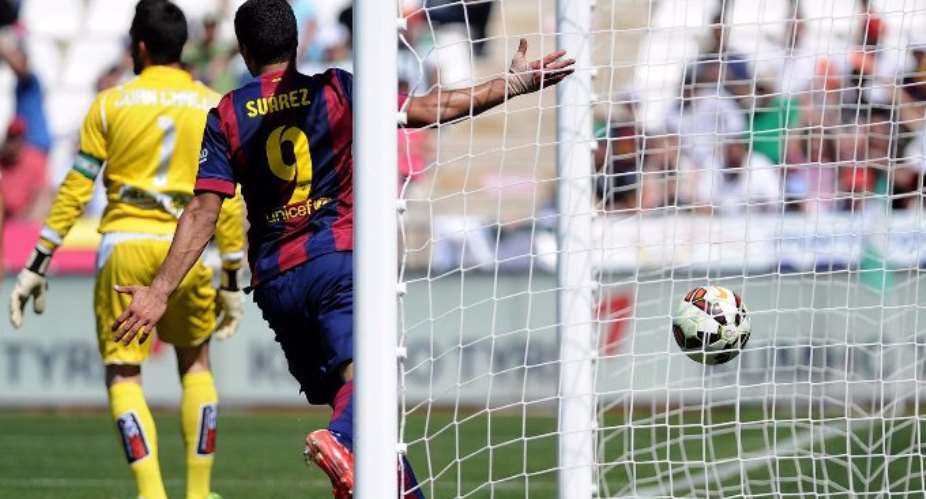 Suarez hits hat-trick as Barcelona put eight past Cordoba