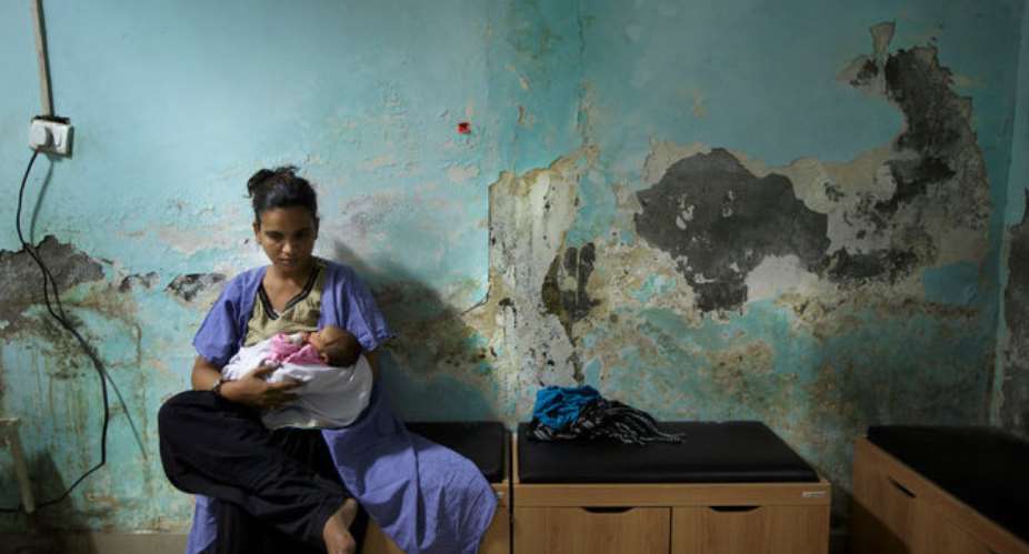 A mother nursing her newborn at a hospital in Haryana, where almost every baby born in hospitals in recent years has been injected with antibiotics. Credit Kuni Takahashi for The New York Times