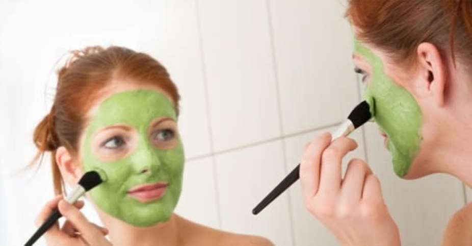 Woman applying Avocado Almond face mask