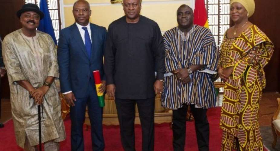 President Mahama and the Chief of Staff Julius Debrah in a pose with the BoG governor and others
