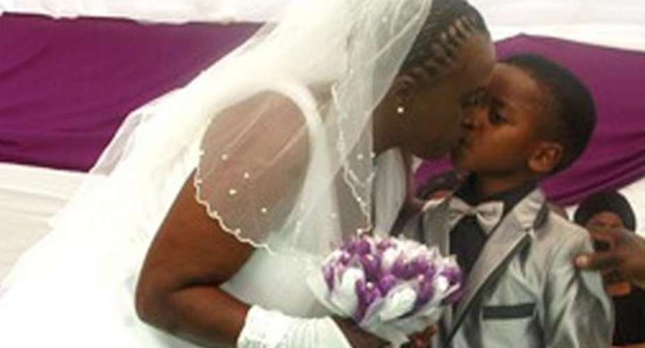Kiss chaste ... Helen Shabangu and her eight-year-old 'husband'