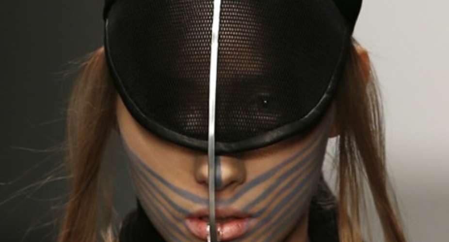 A model presents a creation by Haizhen Wang during London Fashion Week Fall/Winter 2013/14 in London, England, on February 19.