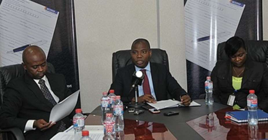 Stephen Abban middle Head of Retail Banking addressed the media