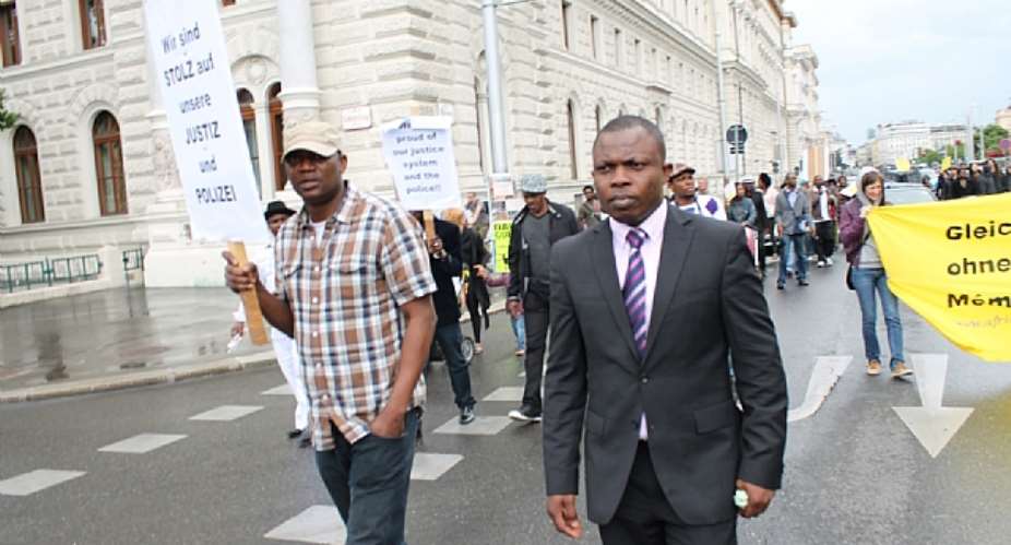 Pastor Joshua Esosa on suit during the protest in Vienna. Photo by Uzoma Ahamefule