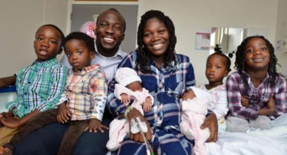 Shaibu Abu-Adama and Abigail Abu-Adama hold their new-born twins with their other two sets: From Left: Ohene,Okese,Nana-Oye,Ohenewa