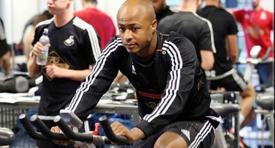 Andre Ayew on a bicycle