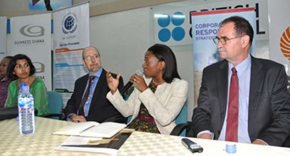 Preba Greenstreet, answering questions at the event. On the right is Professor Wayne Dunn and other dignitaries.