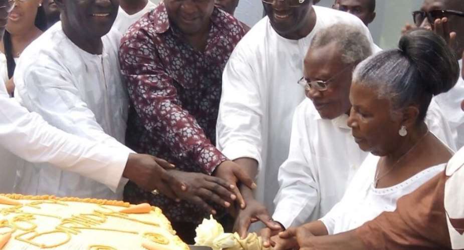 President Mahama helping to cut the birthday cake